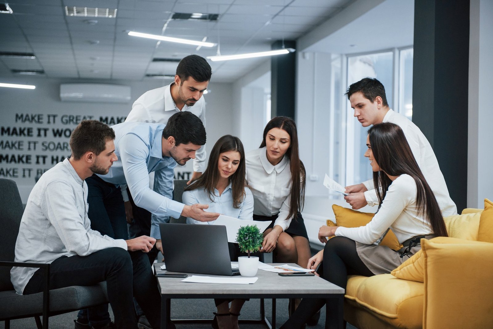 The GenDum Fix team collaborating and reviewing growth systems
